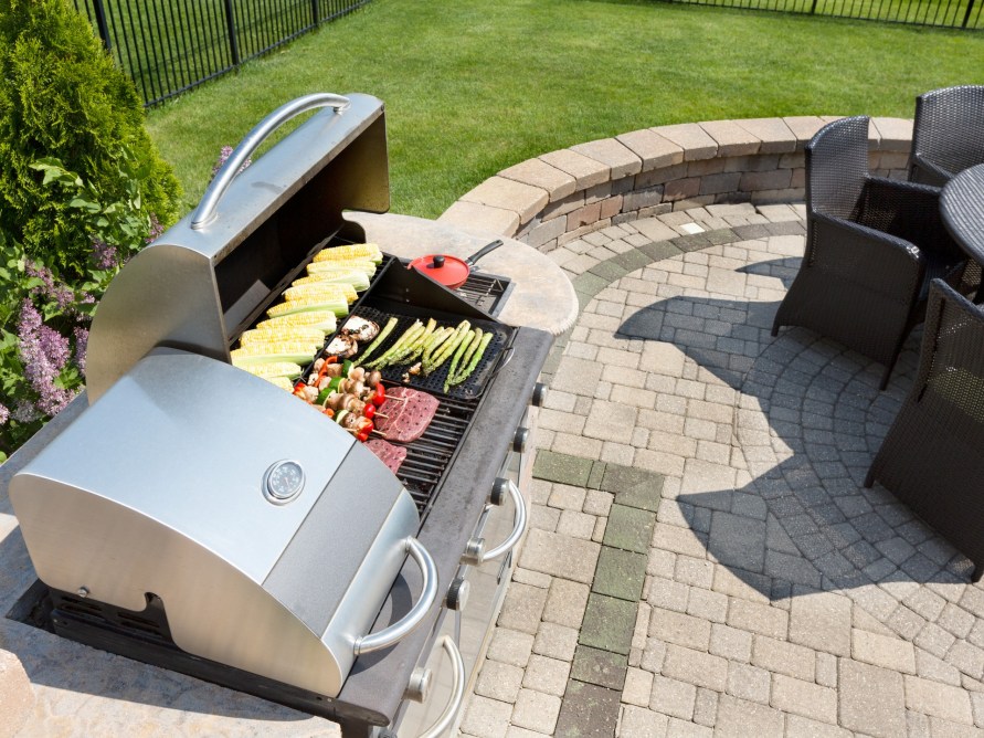 outdoor grill on paver patio