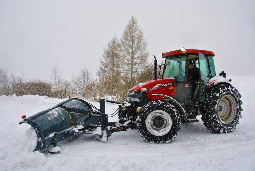 red front end loaded with snow plow